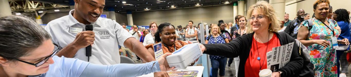 An attendee wins a prize at the 2025 conference