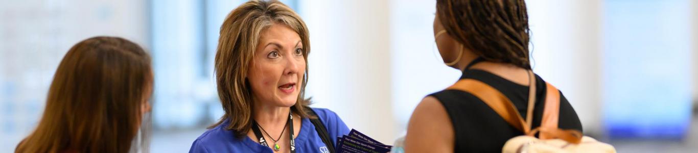 SREB worker helps 2025 attendees