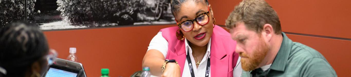 2025 attendees sit and discuss the conference events