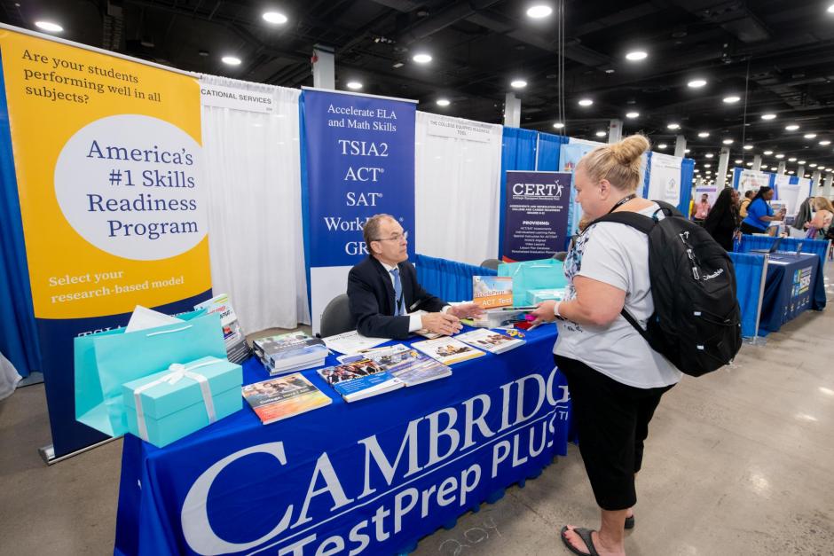 Attendees visiting sponsors at their exhibitor booths